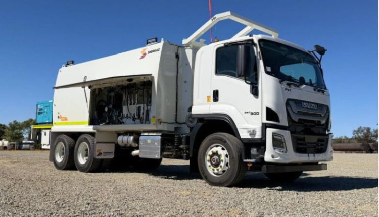 Mine-spec service truck on a remote Australian mine site with safety rails and high-vis markings